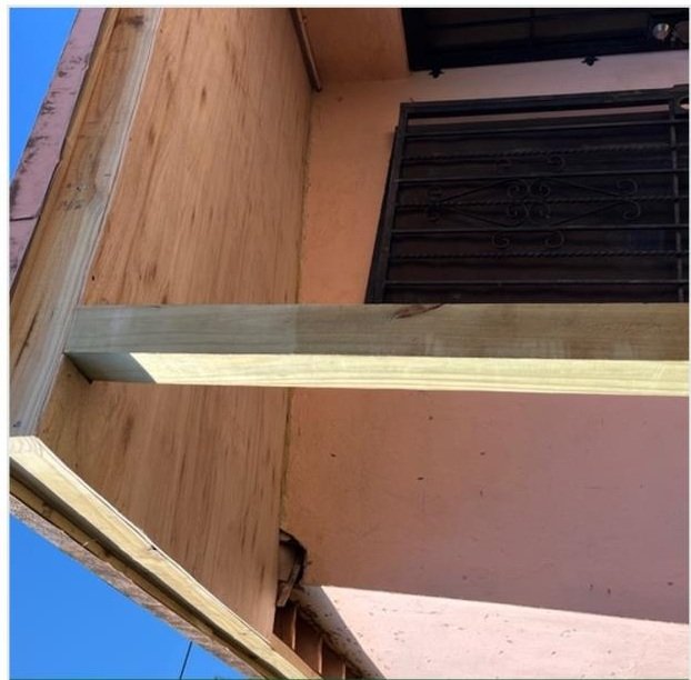 New wood supports during patio roof restoration