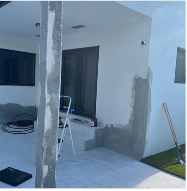Exterior stucco repair in progress